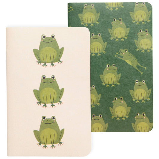 Two notebooks with green frog patterns on a white background