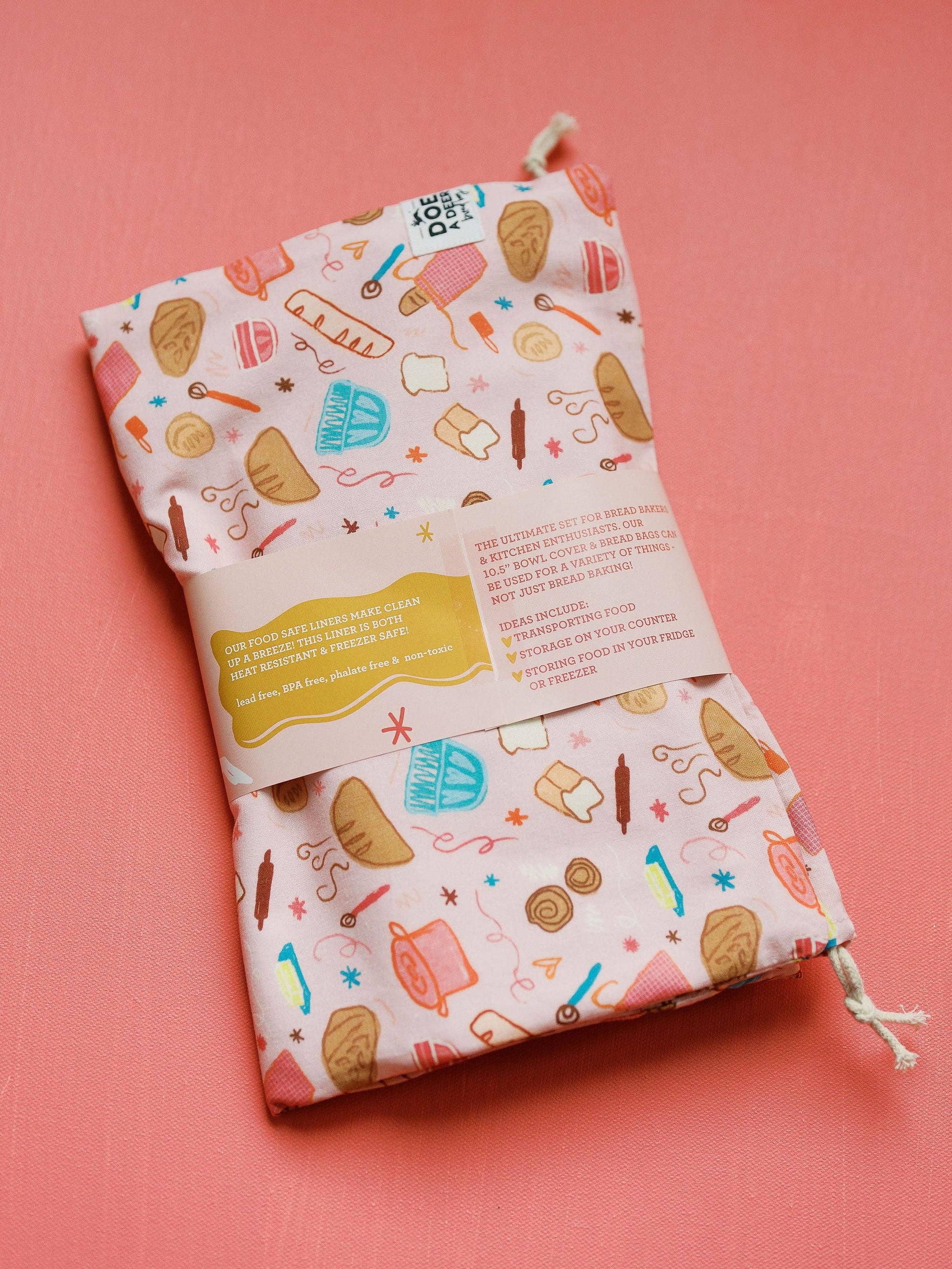 Patterned drawstring bag on a pink background