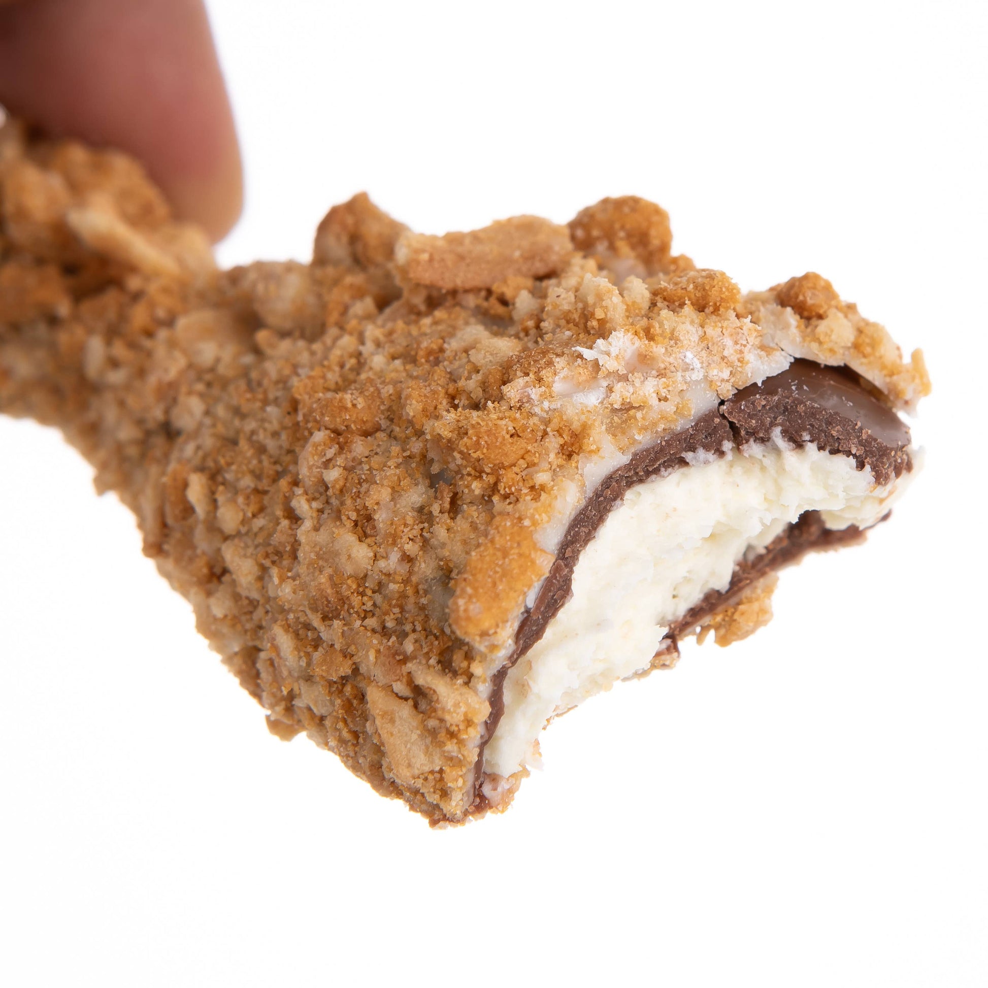 Close-up of a piece of chocolate with chocolate filling on a white background