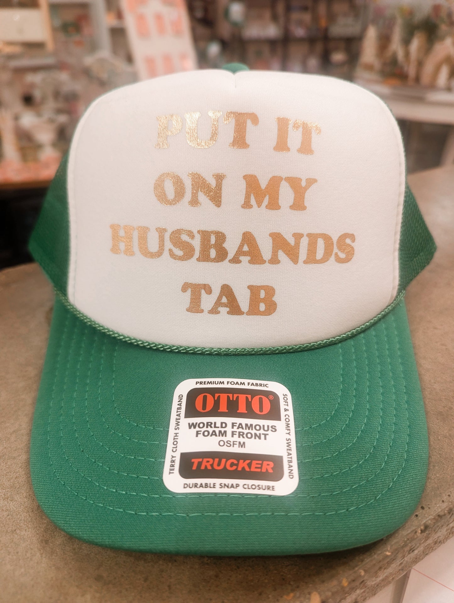 Put It On My Husband's Tab Trucker Hat