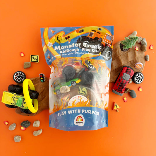 Monster Truck Kiddough Play Kit packaging on an orange background with toy trucks and accessories.