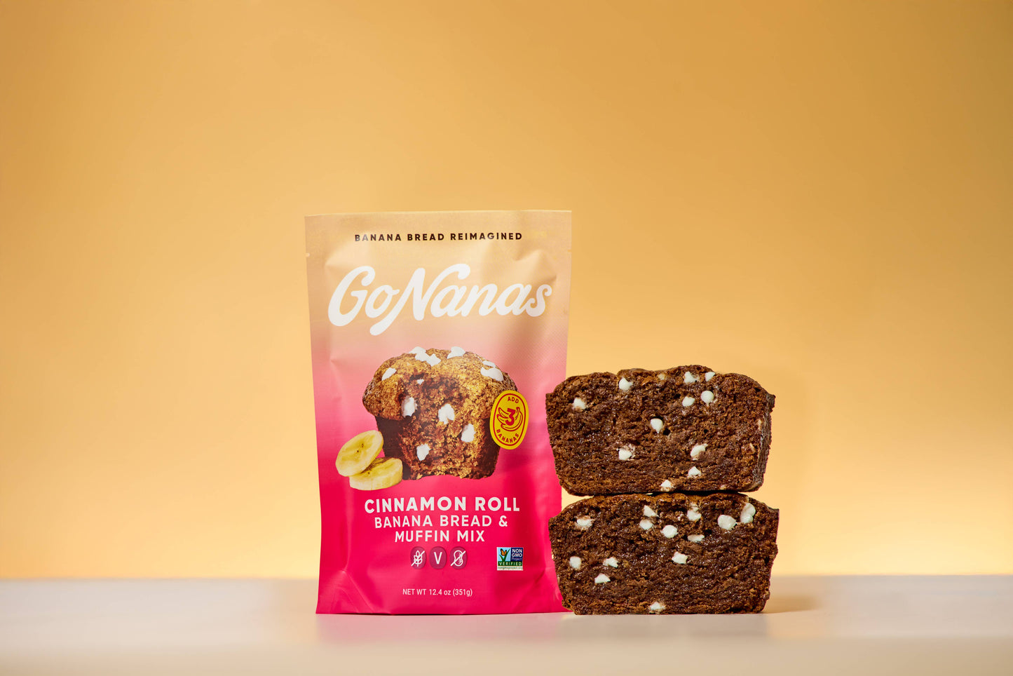 GoNanas cinnamon roll banana bread muffin mix packaging with two muffins on a yellow background
