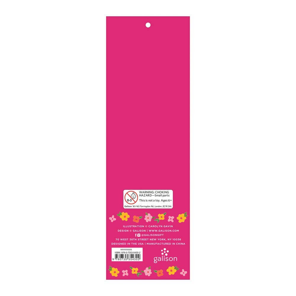Pink label with floral designs and text on a white background