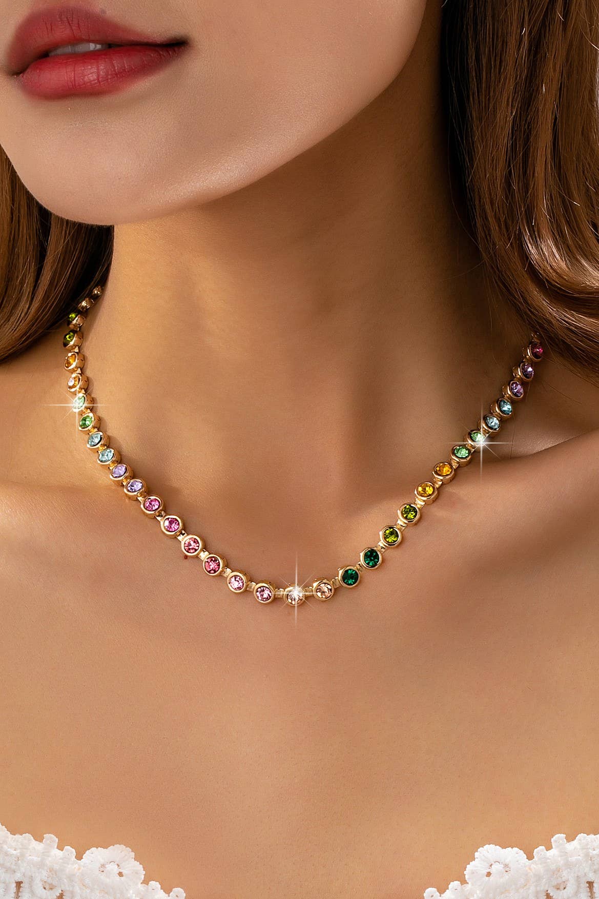 Necklace with multicolored gemstones worn by a model
