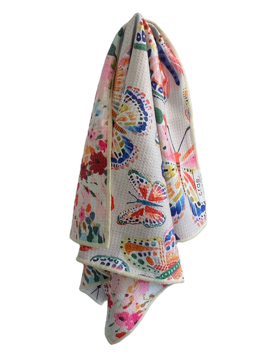 Colorful butterfly patterned towel on a white background