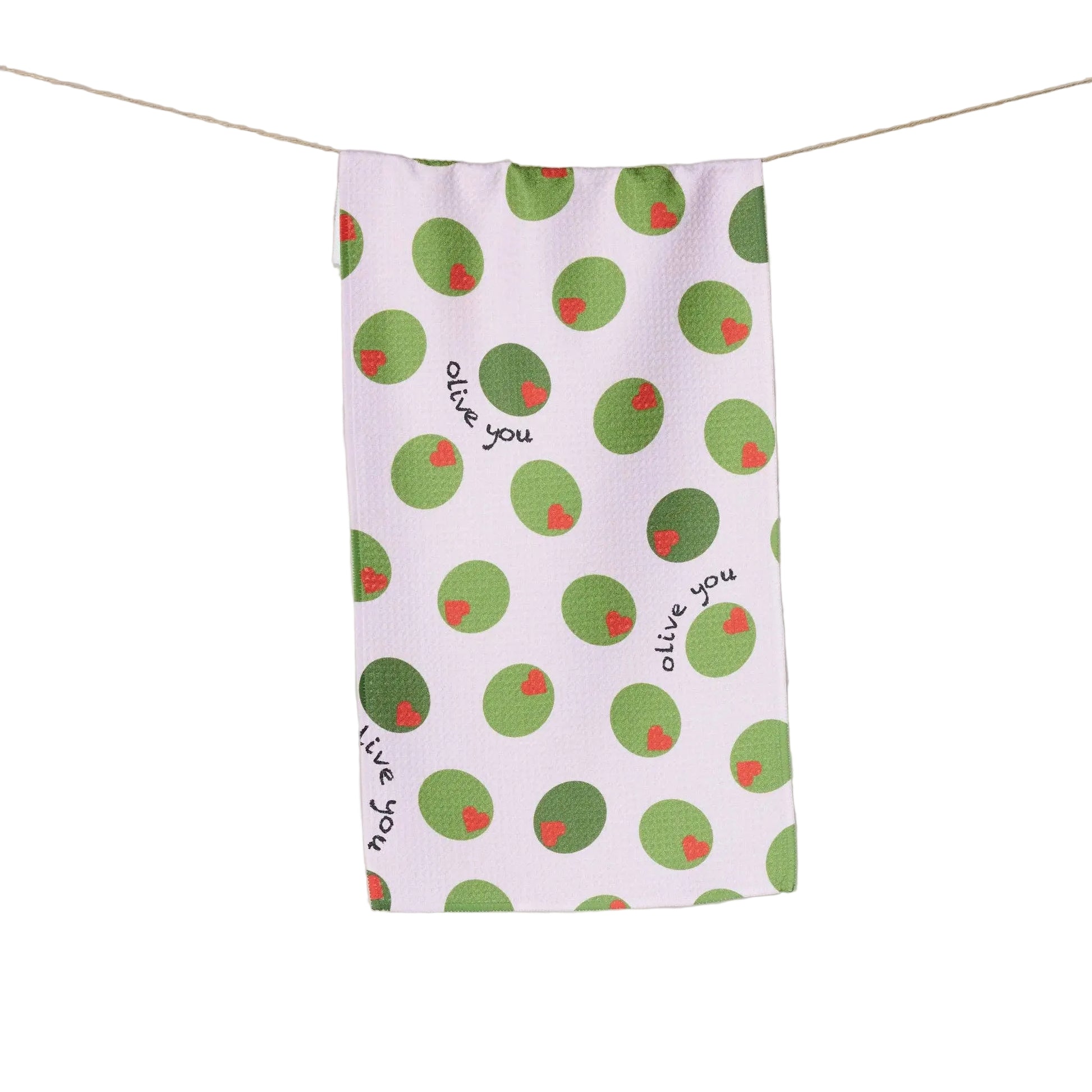 White tea towel with green olives with red heart pimentos pattern and text that reads "Olive You" on a white background