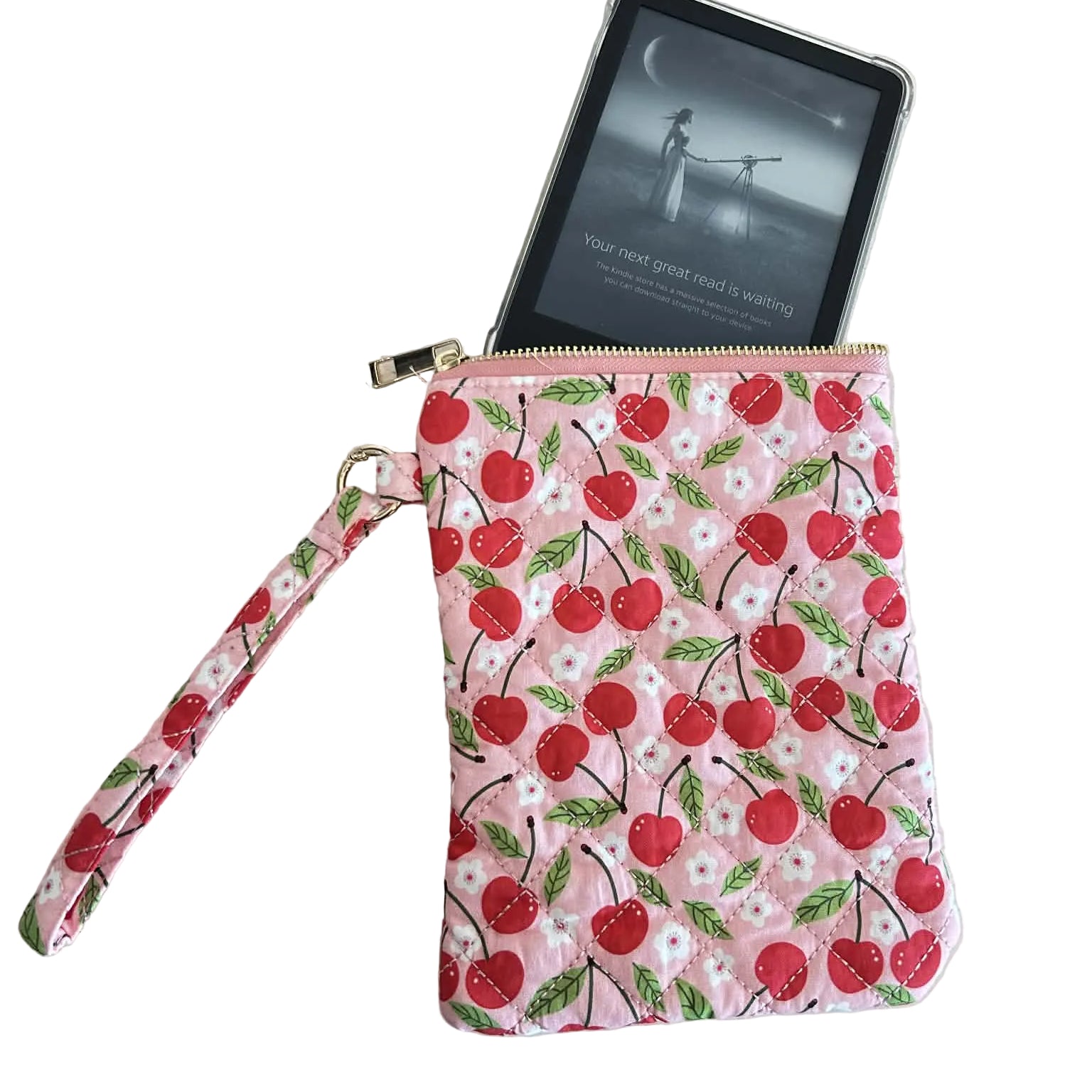 Cherry-patterned pouch with a wrist strap on a light surface