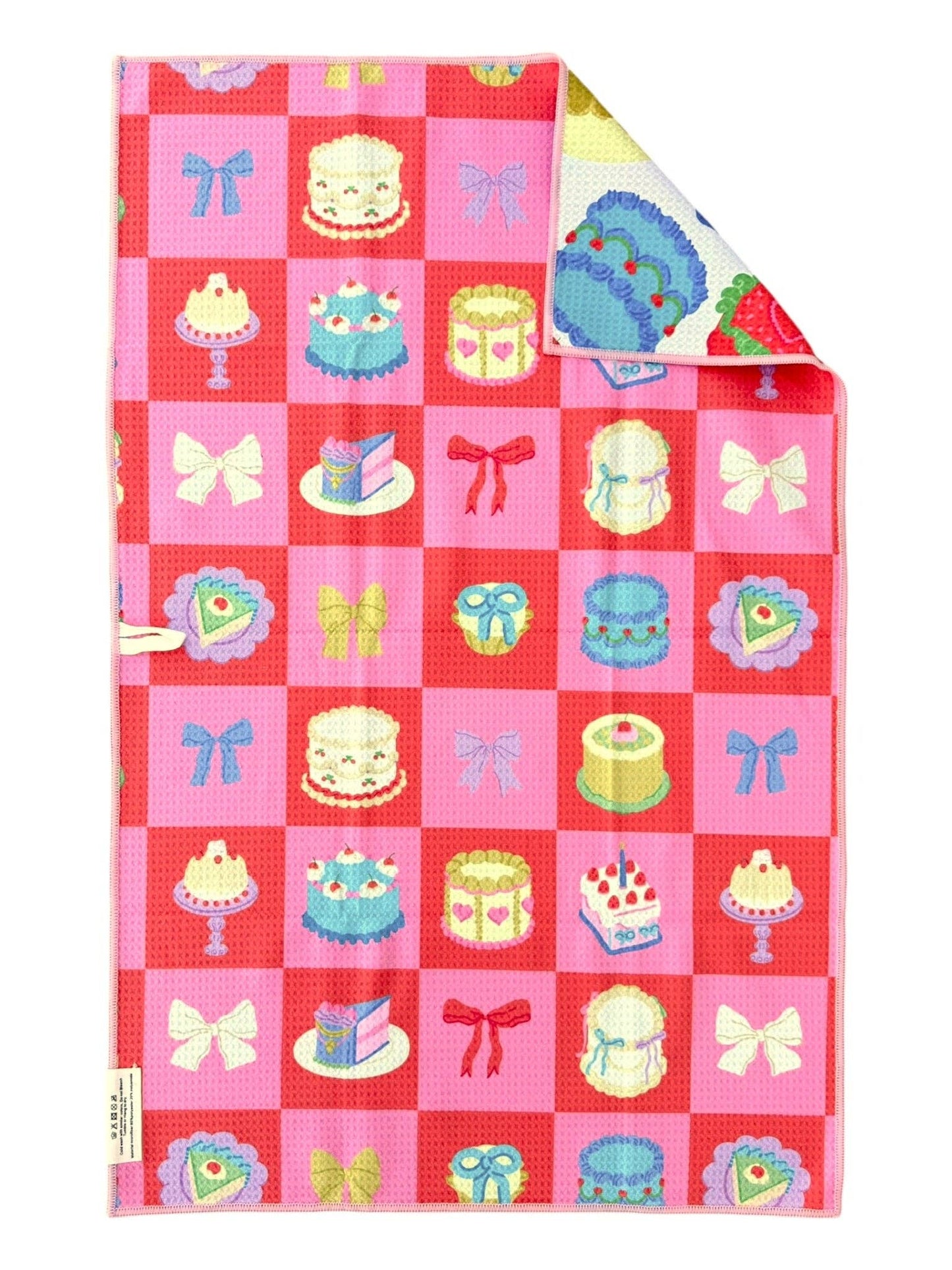 Checkered fabric with cake and bow pattern on a red background