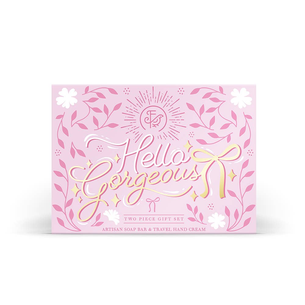 Pink gift set packaging with 'Hello Gorgeous' text and floral designs on a white background