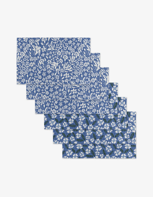 Set of blue floral-patterned boxes on a white background