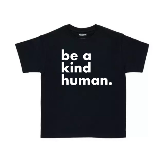 Black t-shirt with 'be a kind human' text on a white background