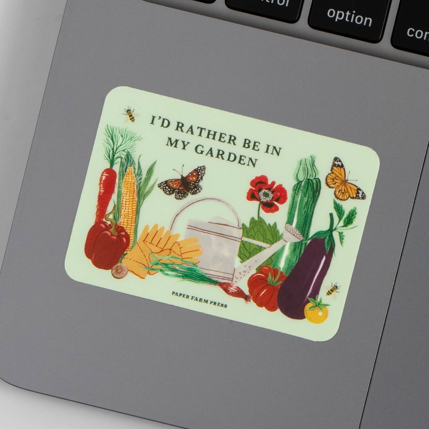 Sticker with garden-themed design on a laptop