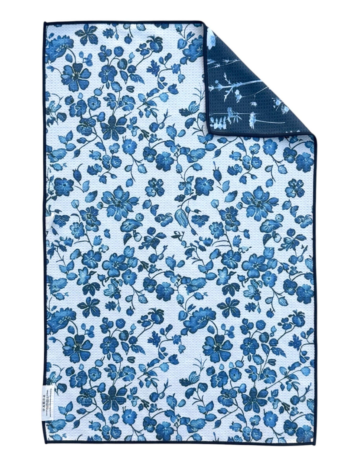 Floral patterned towel with blue flowers on a white background