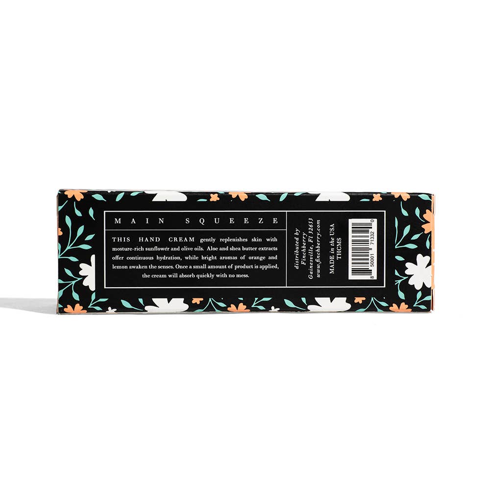Hand cream packaging with floral design on a white background