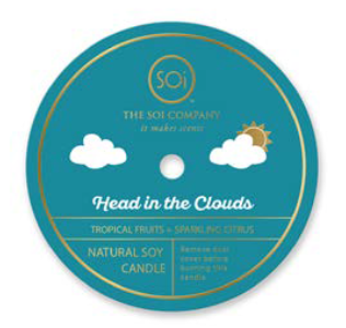 Candle packaging with 'Head in the Clouds' flavor on a blue background