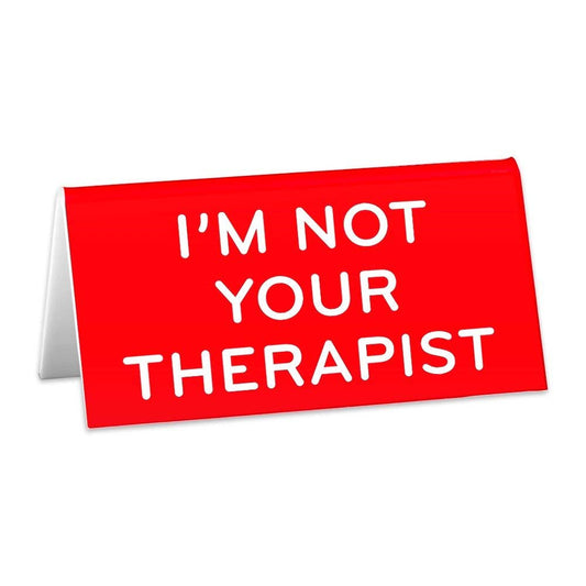 red desk sign that says "Im not your therapist"