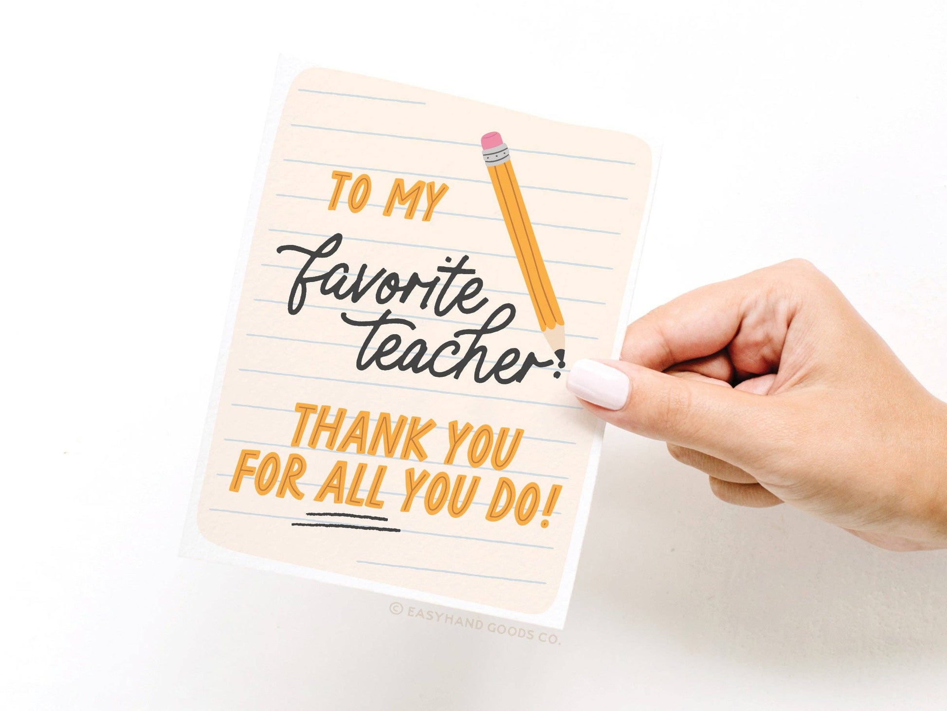 Hand holding a card with 'To my favorite teacher, thank you for all you do!' text on a white background