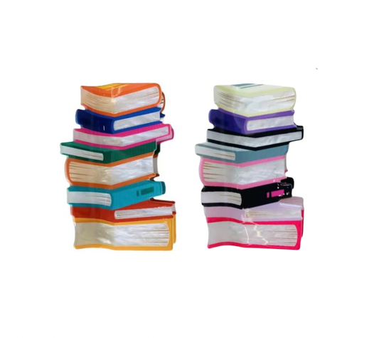 Stacks of colorful plastic books on a white background