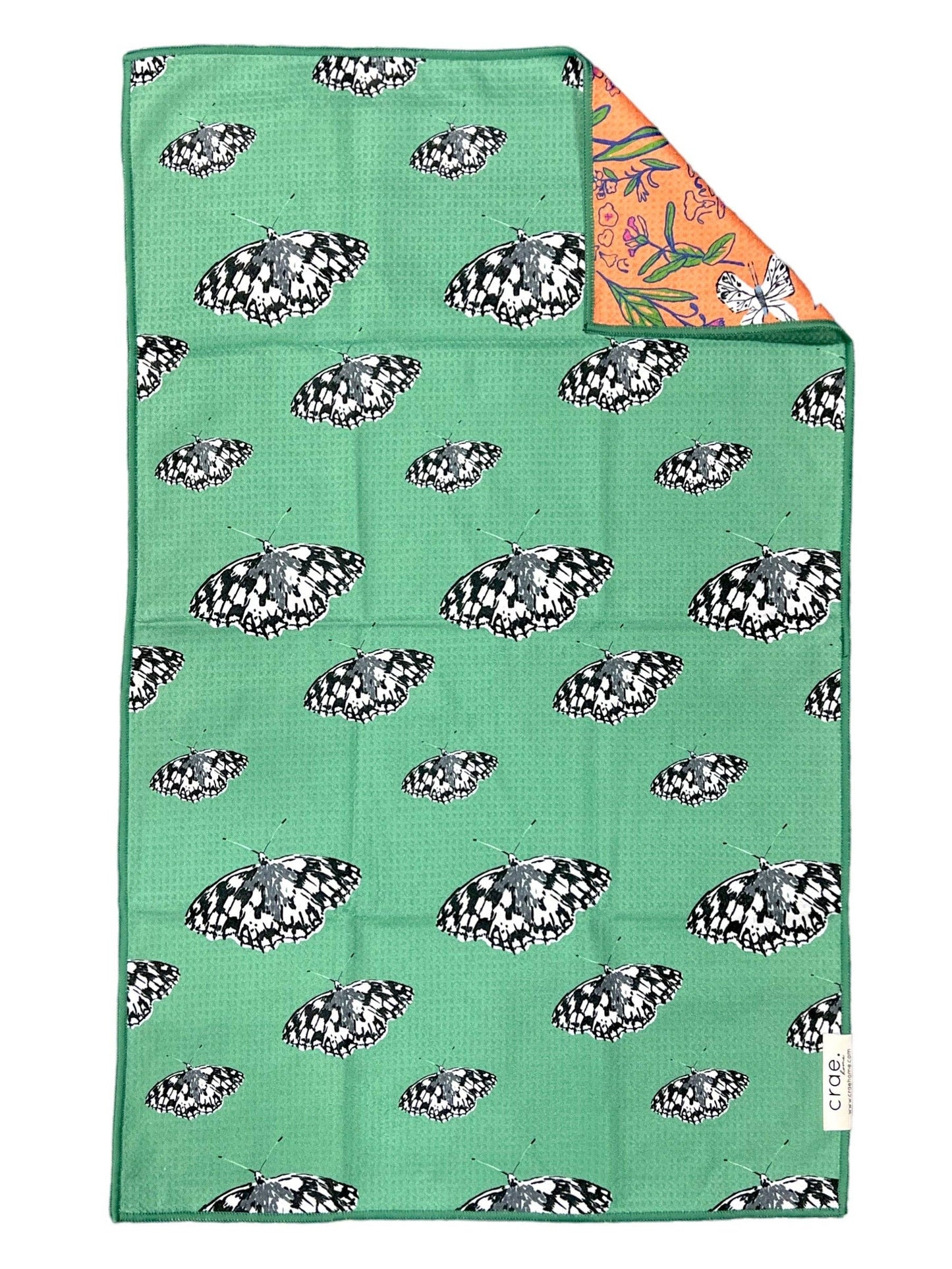 Green fabric with butterfly pattern and colorful corner
