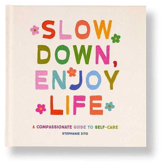 Book cover with colorful text 'Slow Down, Enjoy Life' on a beige background