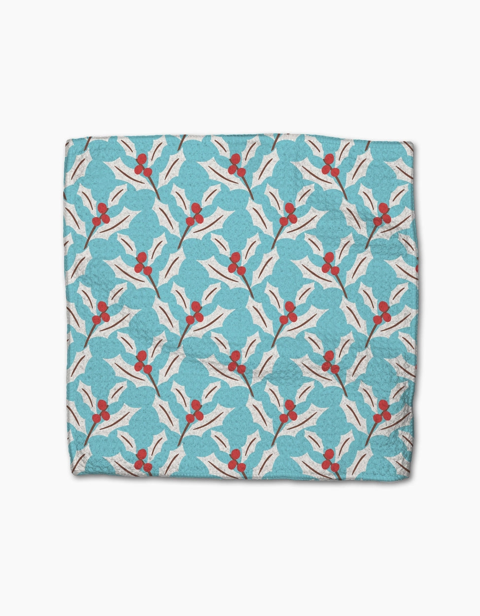 Patterned fabric with red berries and white leaves on a blue background