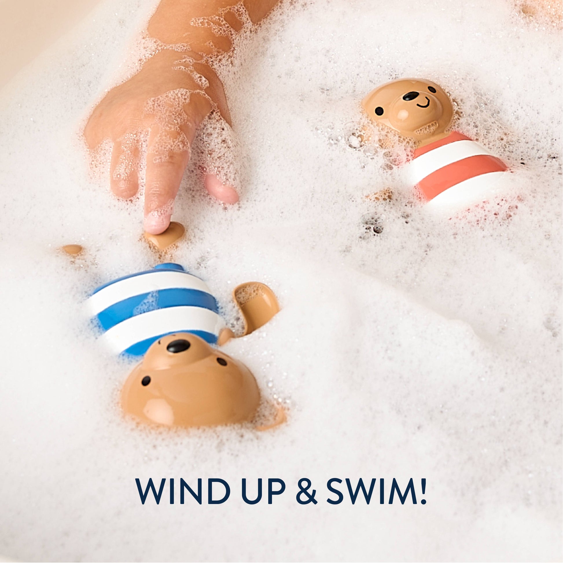Bath toys with striped swimsuits in bubbles, labeled 'Wind Up & Swim!'.