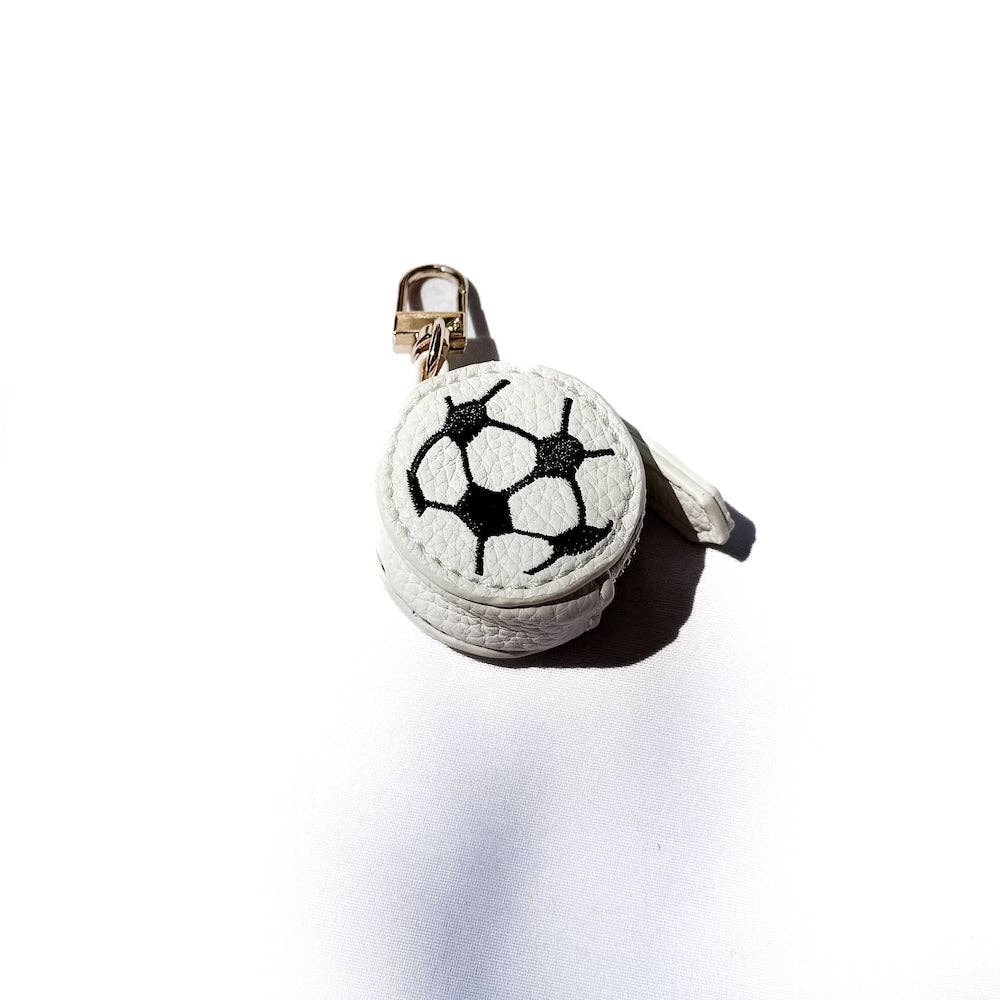 Small round pouch with soccer ball design on a white background