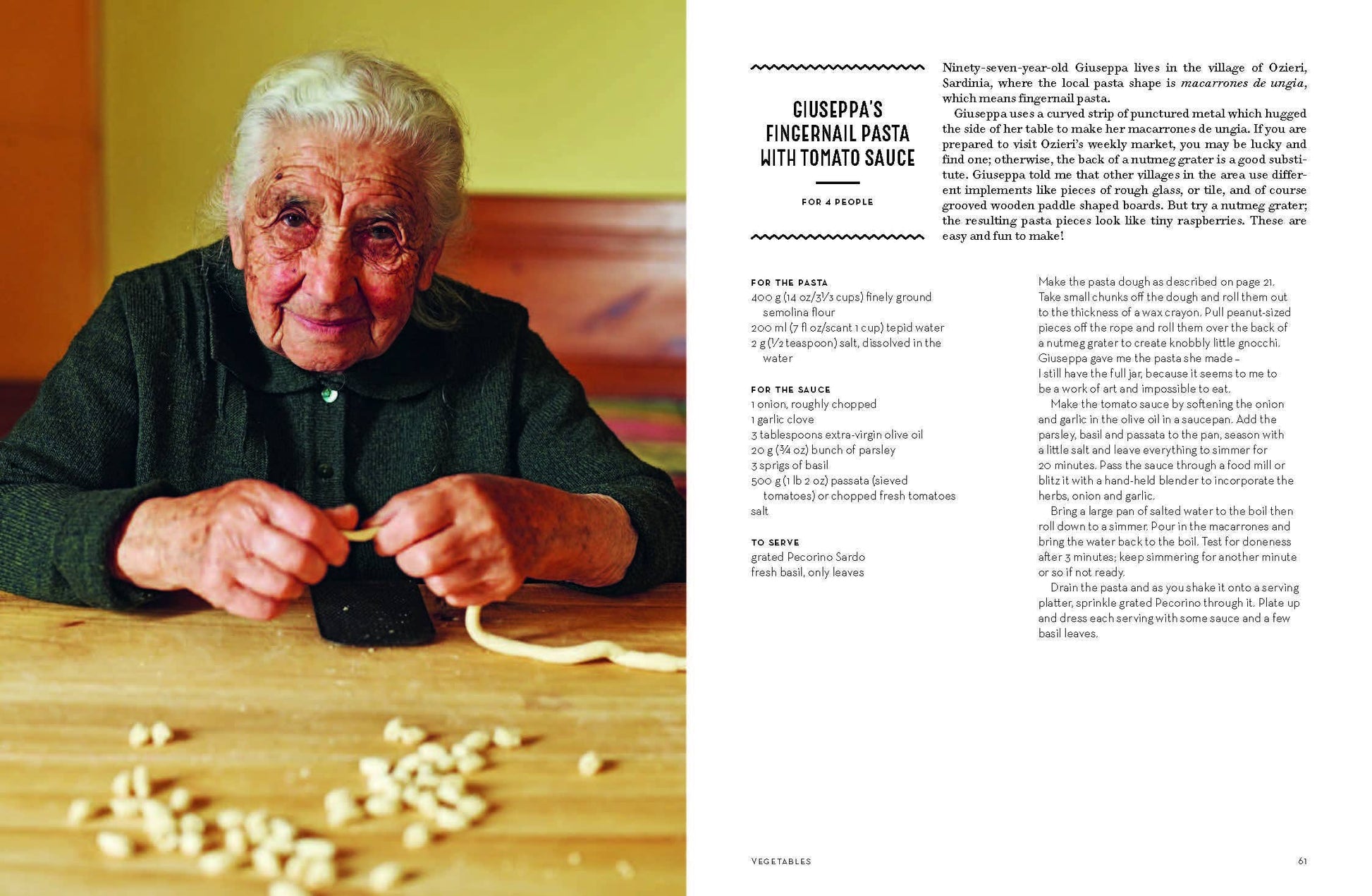 Older woman making pasta with a recipe on the side