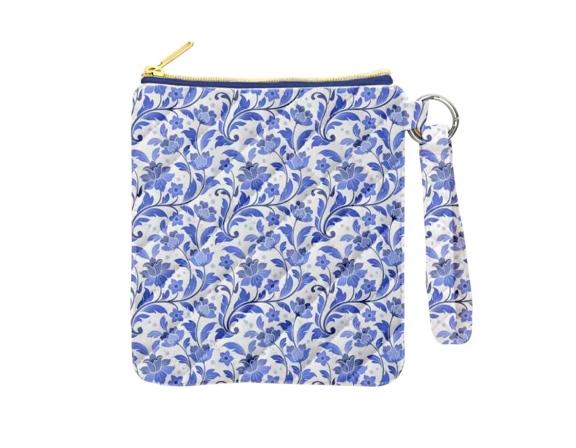 Floral patterned pouch with a strap on a white background