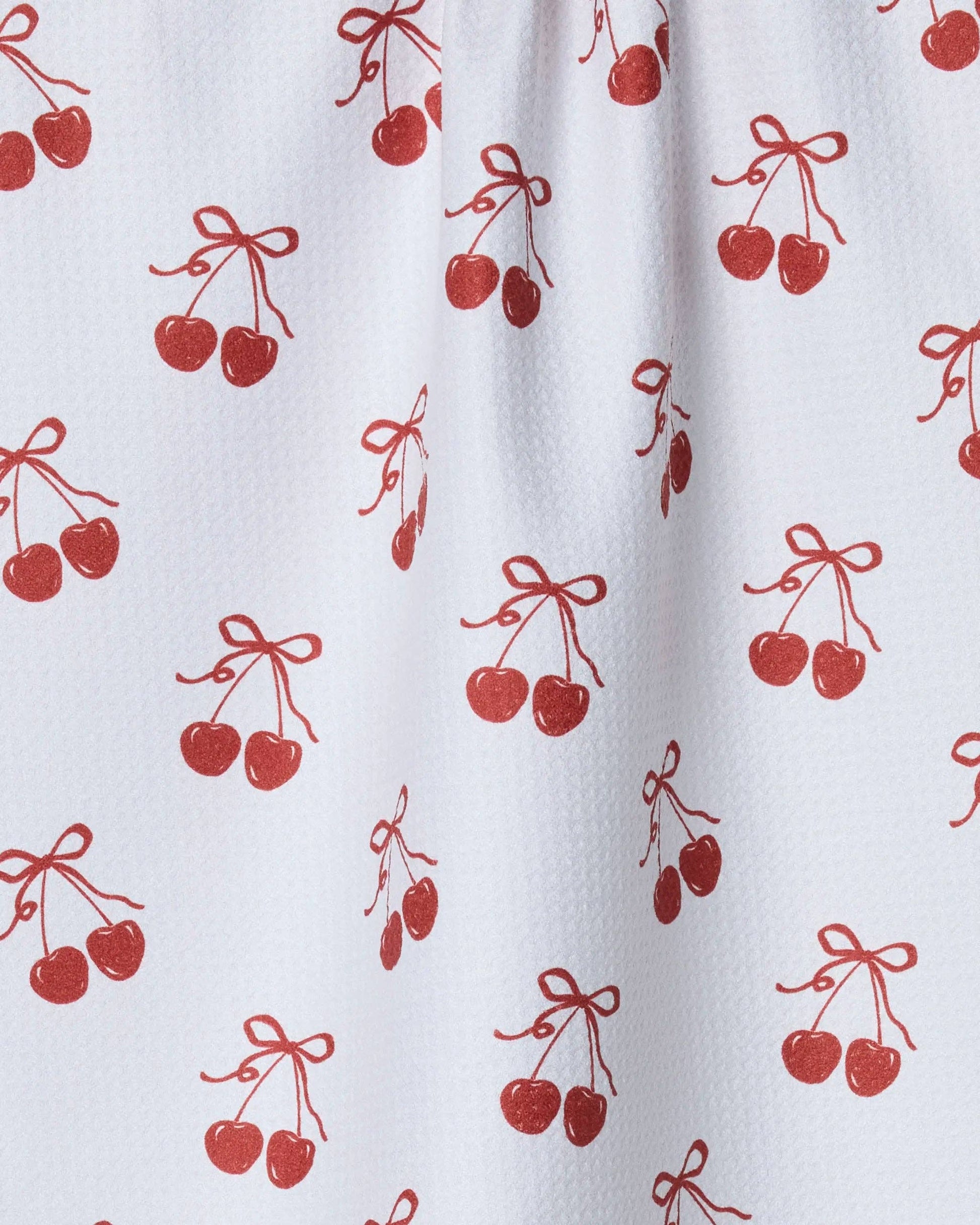 White tea towel with red cherry pattern