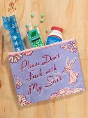 Small pouch with floral design and text on a wooden surface