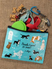 Pouch with dog-themed illustrations and small dog toys on a textured surface