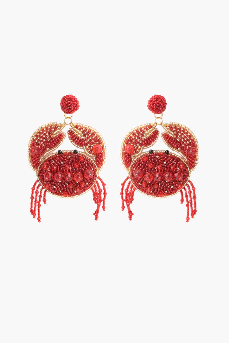 Red crab-shaped earrings with gold accents on a white background