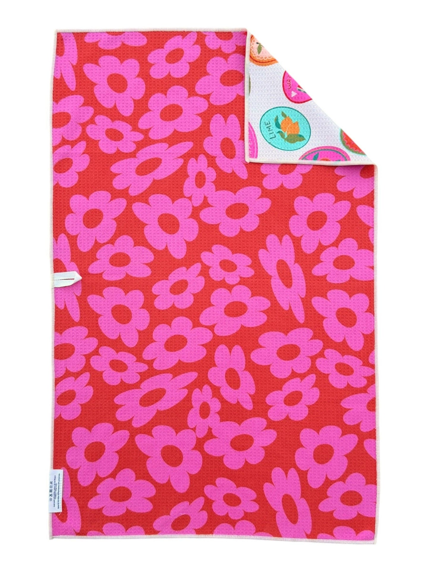 Red blanket with pink floral pattern on a white background