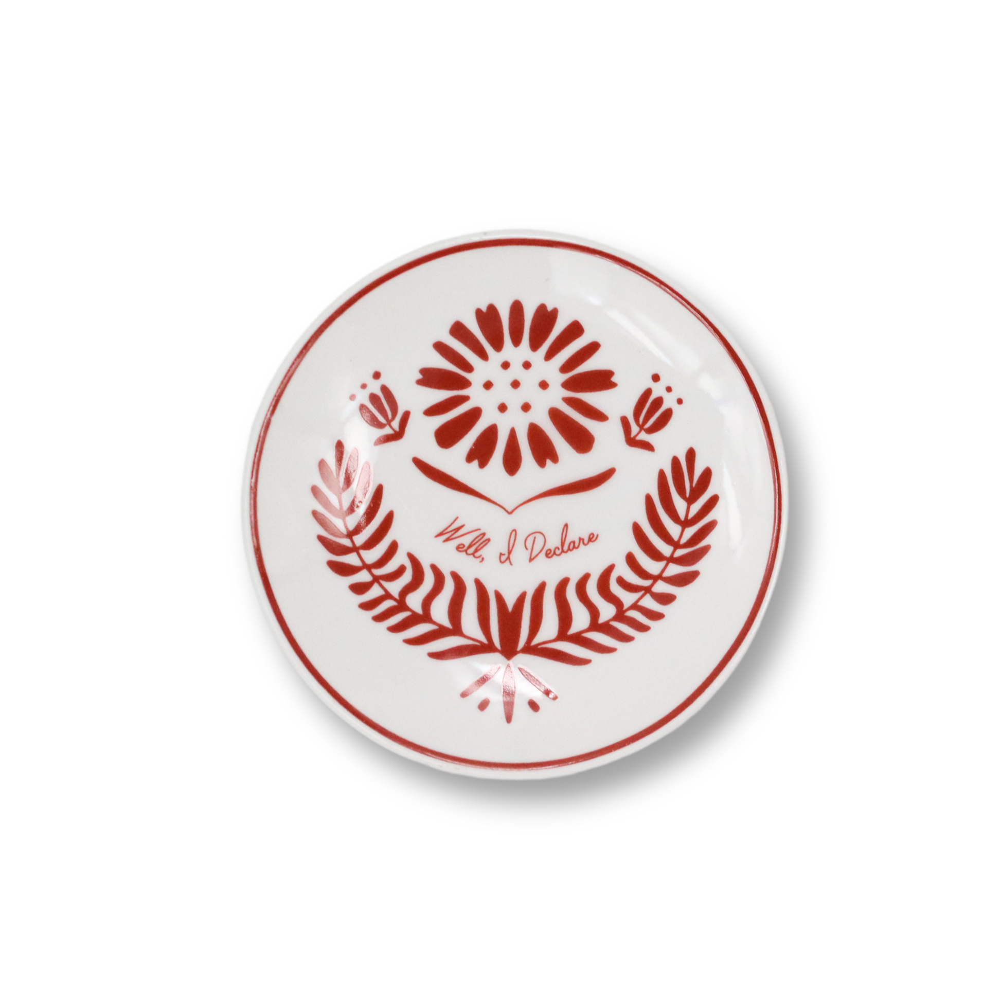 White butter pat with red floral design and text on a white background