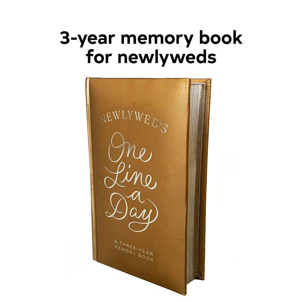 Gold memory book titled 'One Line a Day' for newlyweds on a white background