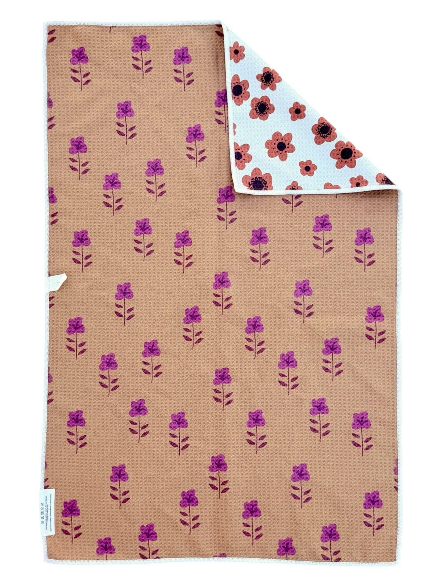 Floral-patterned fabric with purple flowers on a brown background