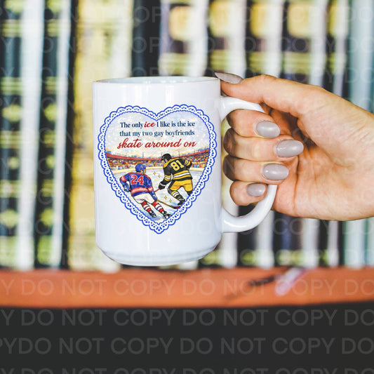 Person holding a mug with hockey-themed design and text.
