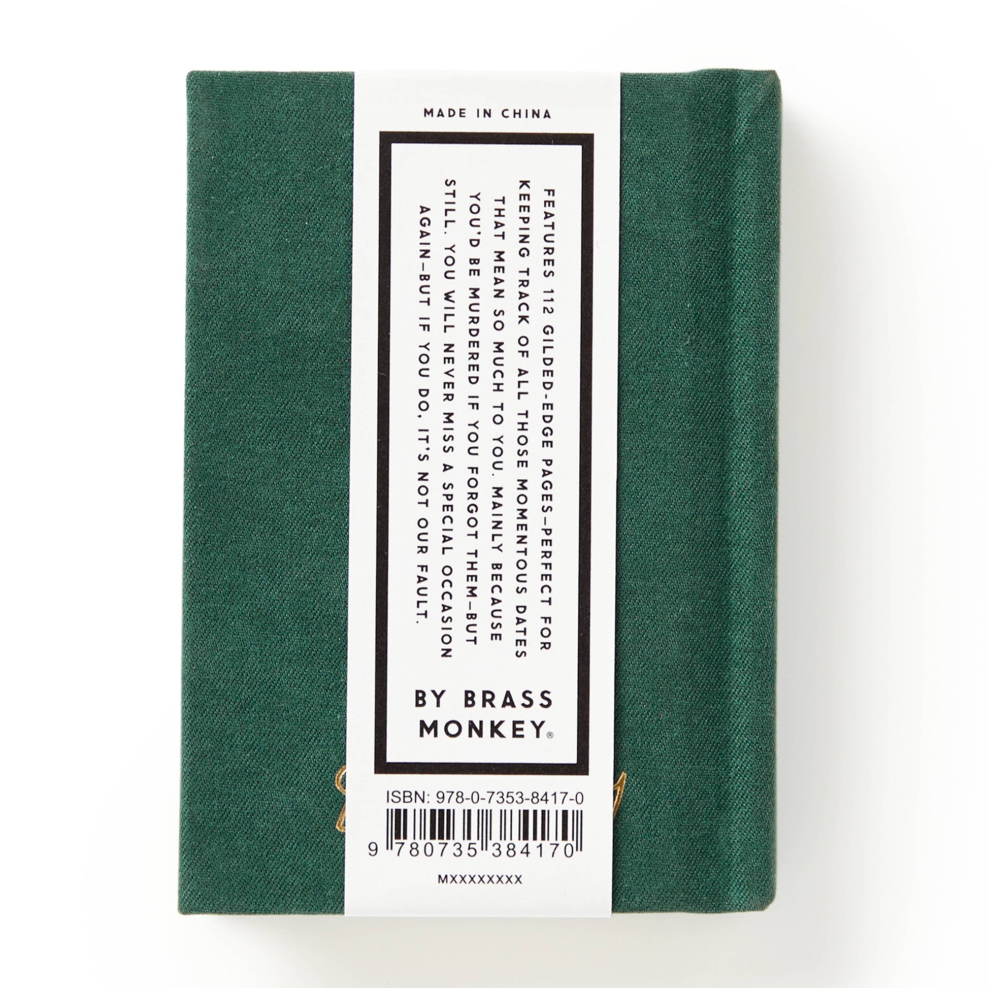 Green book with a label on a white background