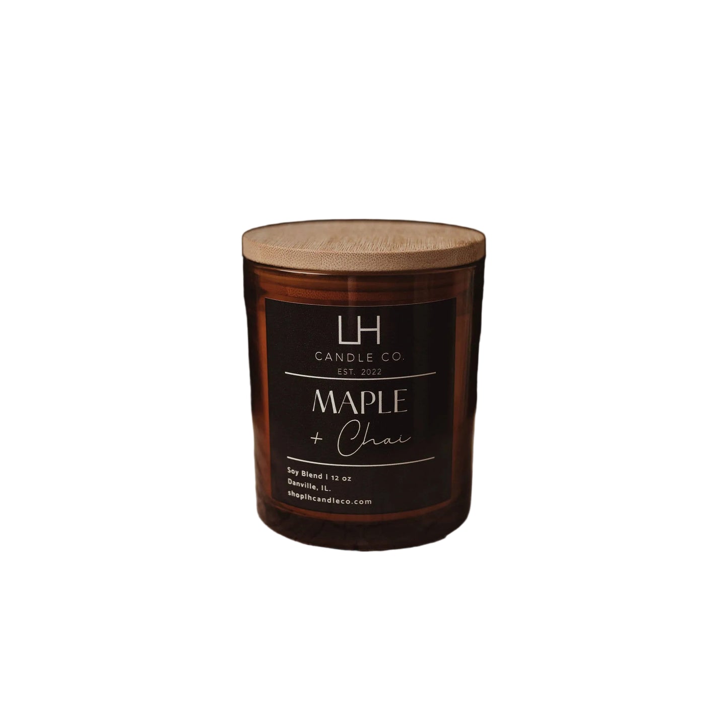 A jar candle labeled 'Maple & Chai' by LH Candle Co. sits on a white background.
