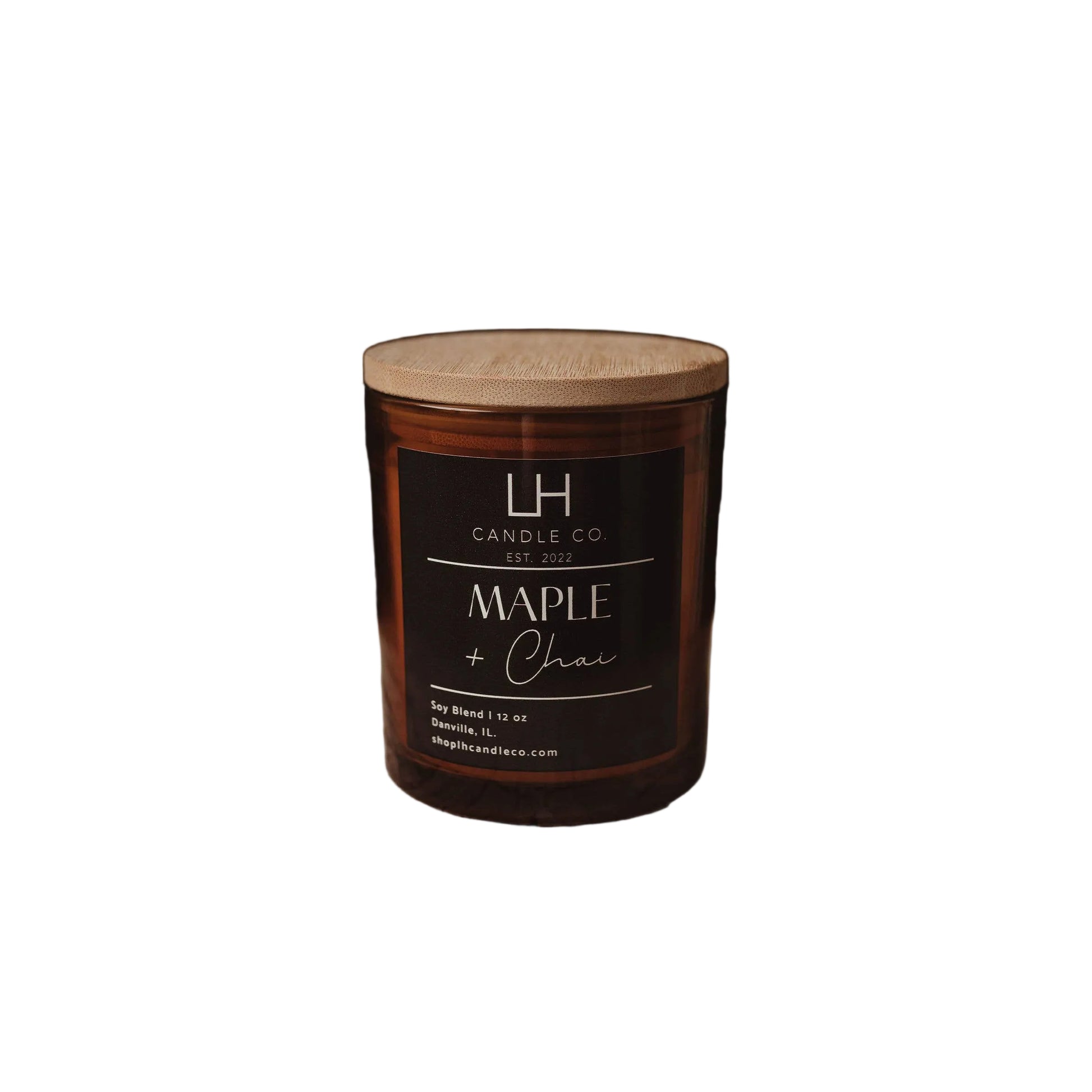 A jar candle labeled 'Maple & Chai' by LH Candle Co. sits on a white background.