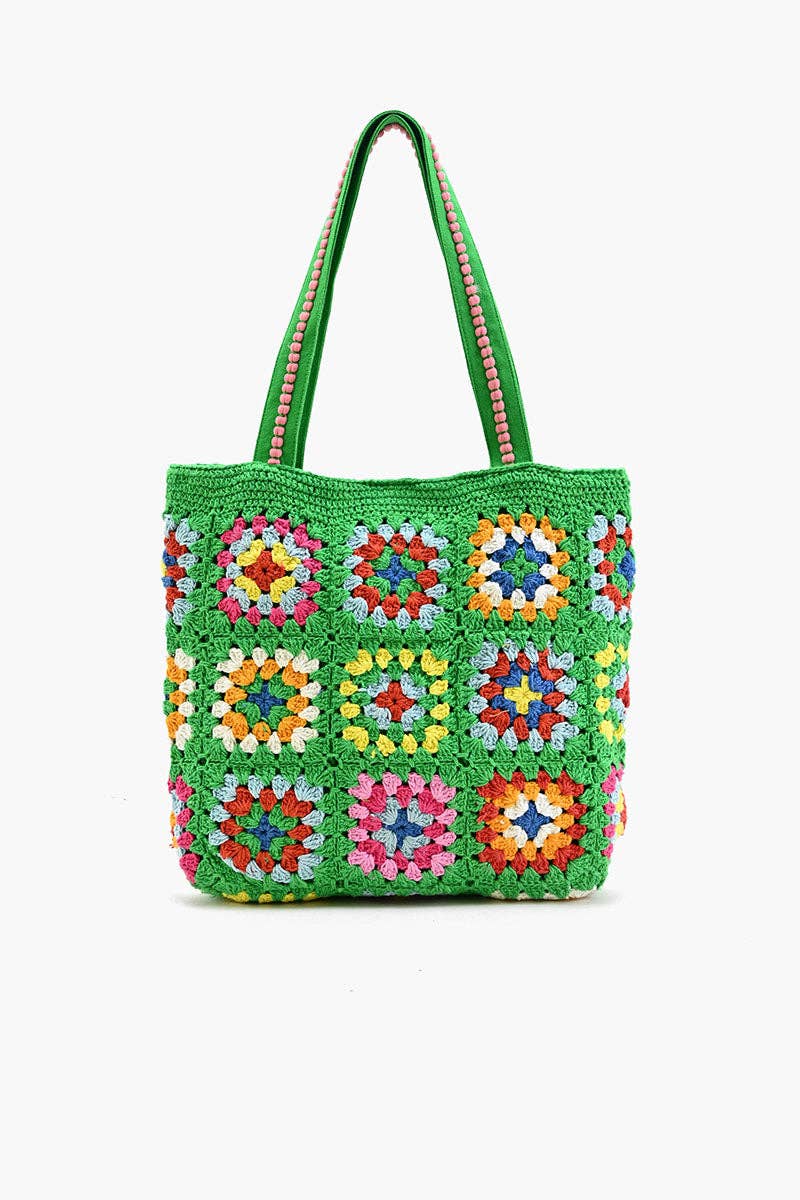 Colorful crochet bag with floral patterns on a white background