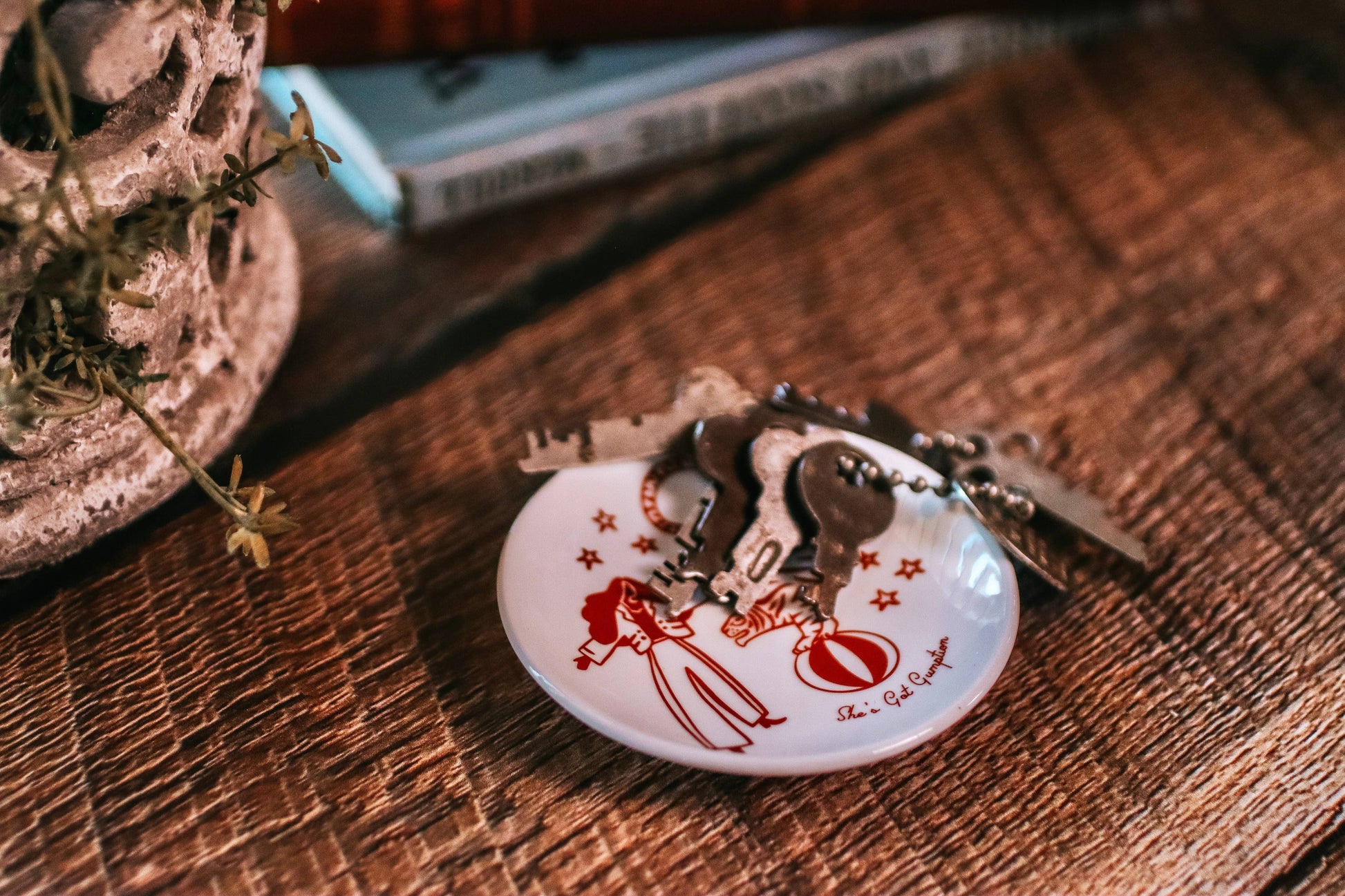 Decorative keychain with a design on a wooden surface