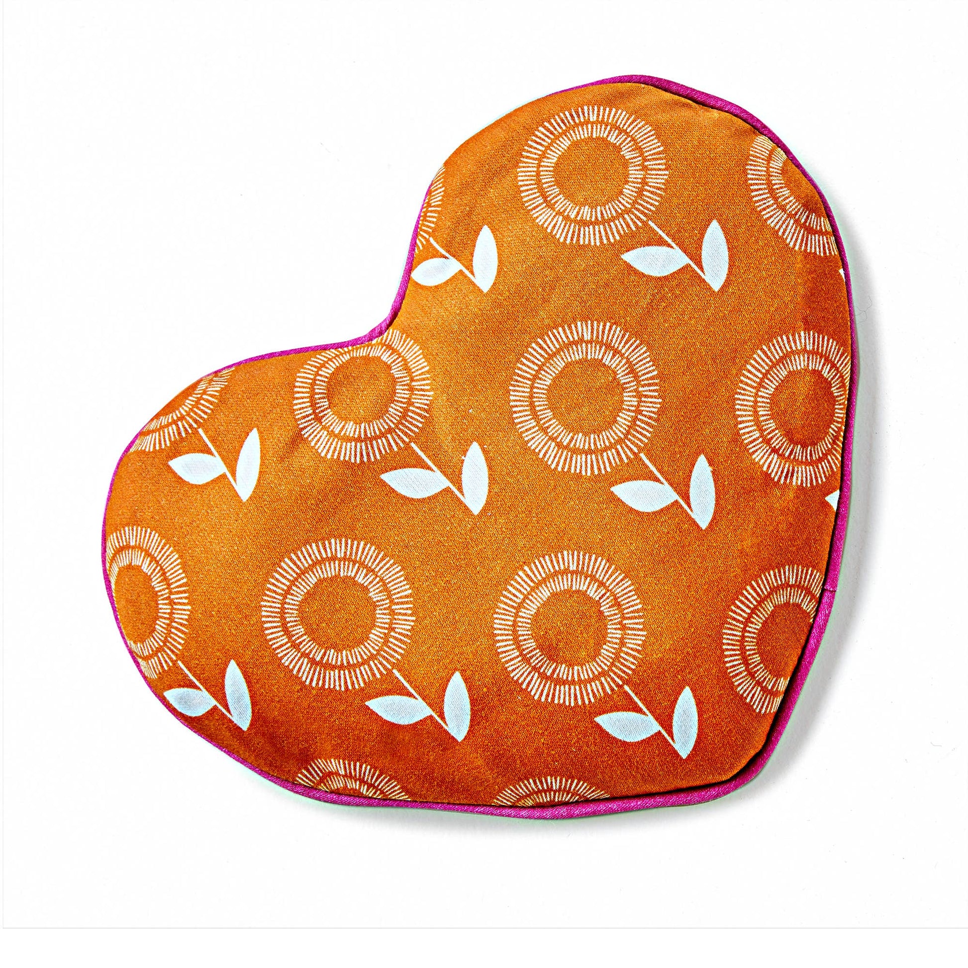 Orange heart-shaped pillow with  white sunflower pattern and hot pin trim on a white background