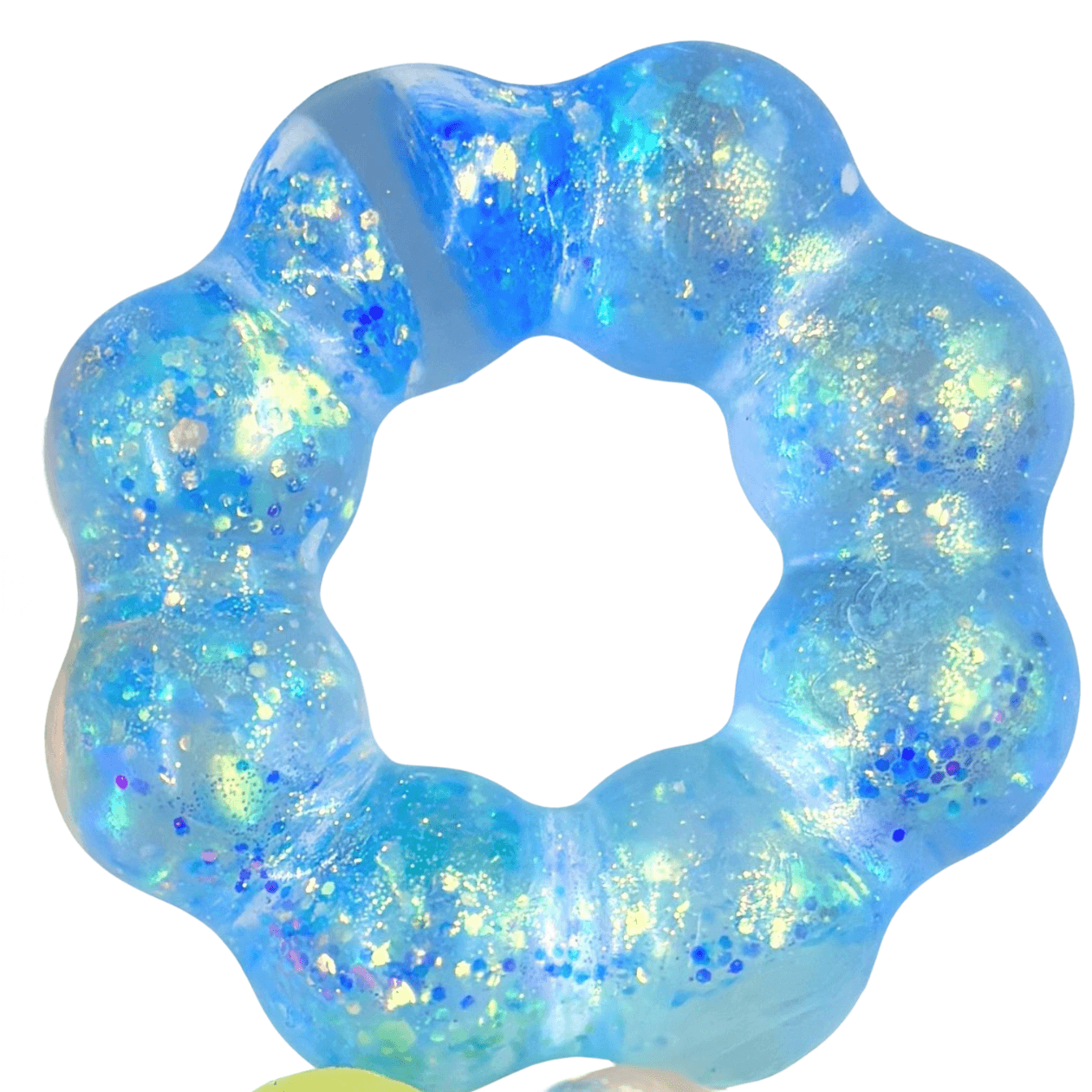 Blue and green glittery ring on a white background