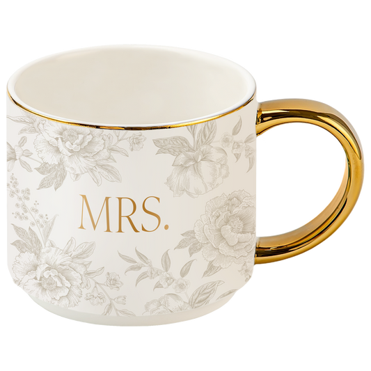 White mug with floral pattern and gold handle, featuring the word 'MRS.'