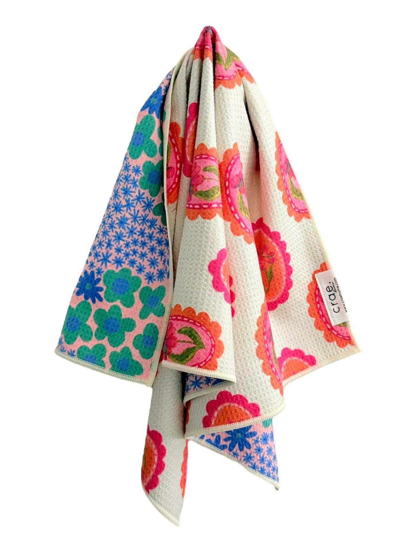 Colorful floral patterned towel on a white background