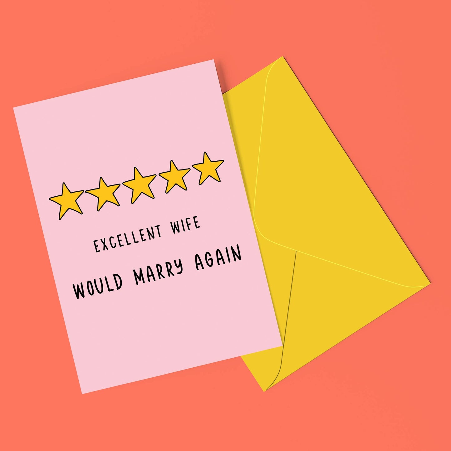 Card with stars and text 'Excellent wife would marry again' on a pink card with a yellow envelope against a coral background.
