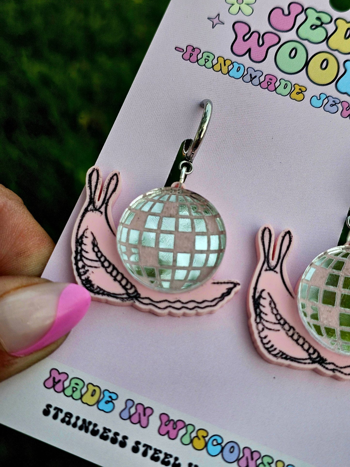 Discoball-shaped earrings on a card with 'Made in Wisconsin' text