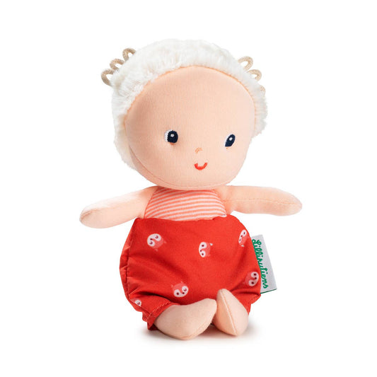 Stuffed doll with red outfit and white headband on a white background
